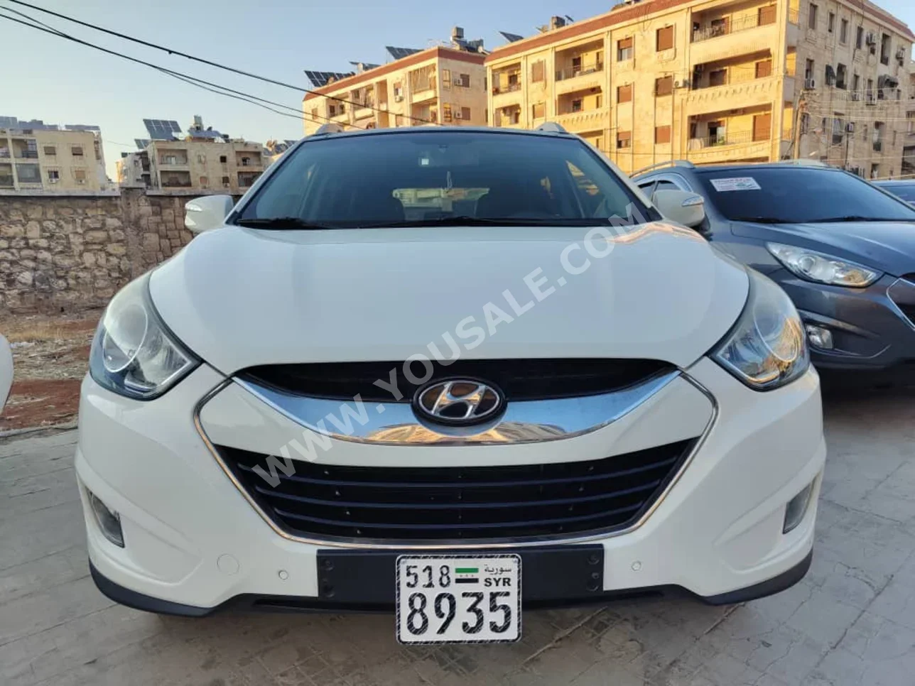 Hyundai  Tucson  2012  Automatic  140,000 km  4 Cylinder  FWD  SUV  White  Gasoline