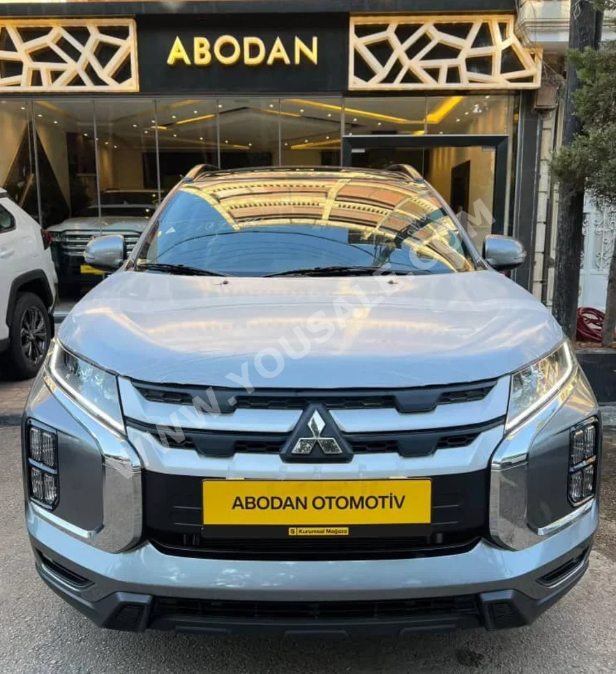متسوبيشي  اي اس اكس  2024  اتوماتيك  0 كم  4 سلندر  دفع رباعي  اس يو في  رمادي  بنزين