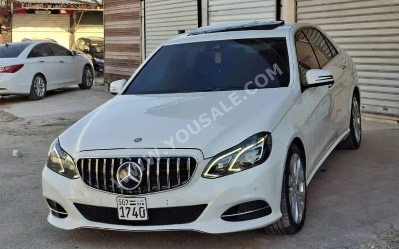 Mercedes-Benz  E-Class  220  2014  Automatic  115,000 km  4 Cylinder  RWD  Sedan  White  Gasoline