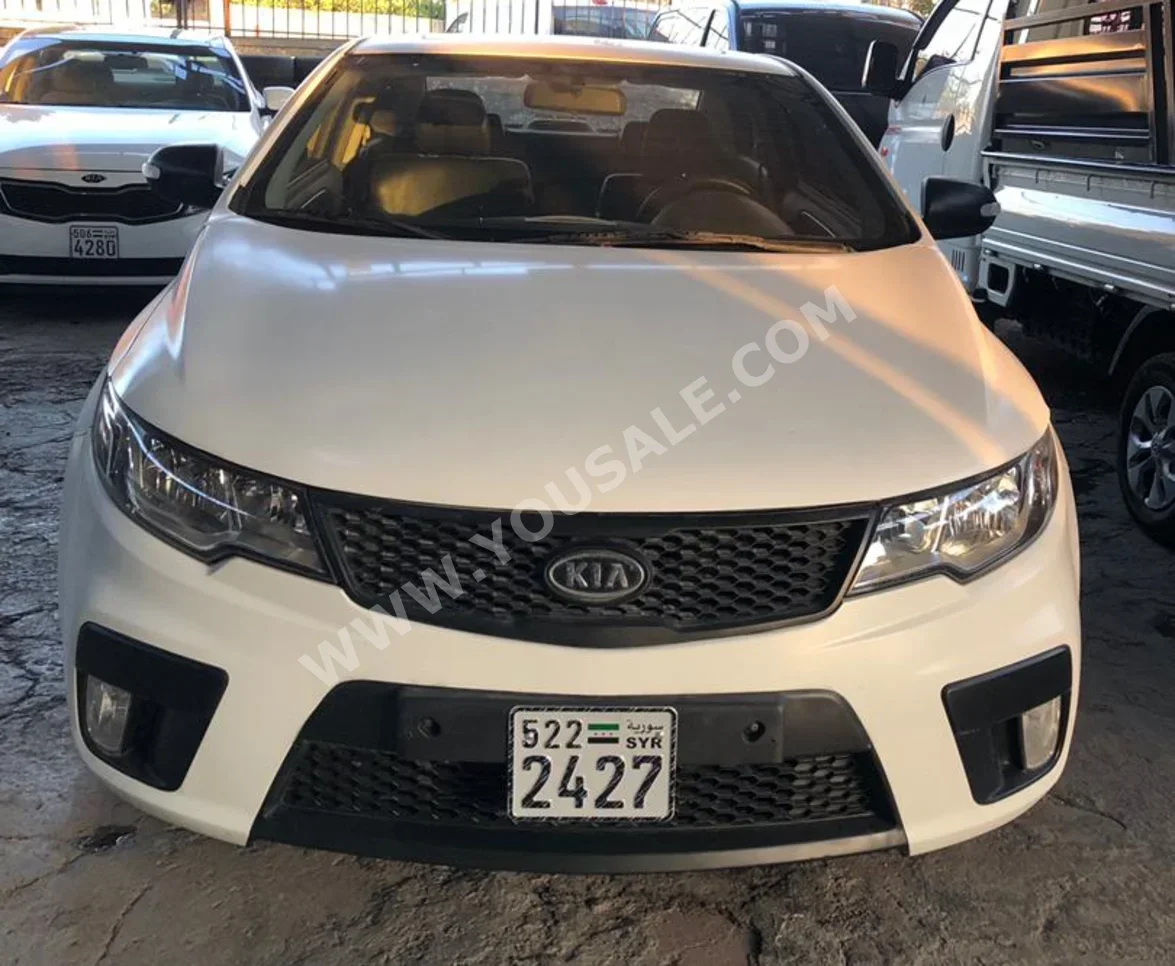Kia  Forte  2010  Manual  123,000 km  4 Cylinder  RWD  Coupe / Sport  White  Gasoline