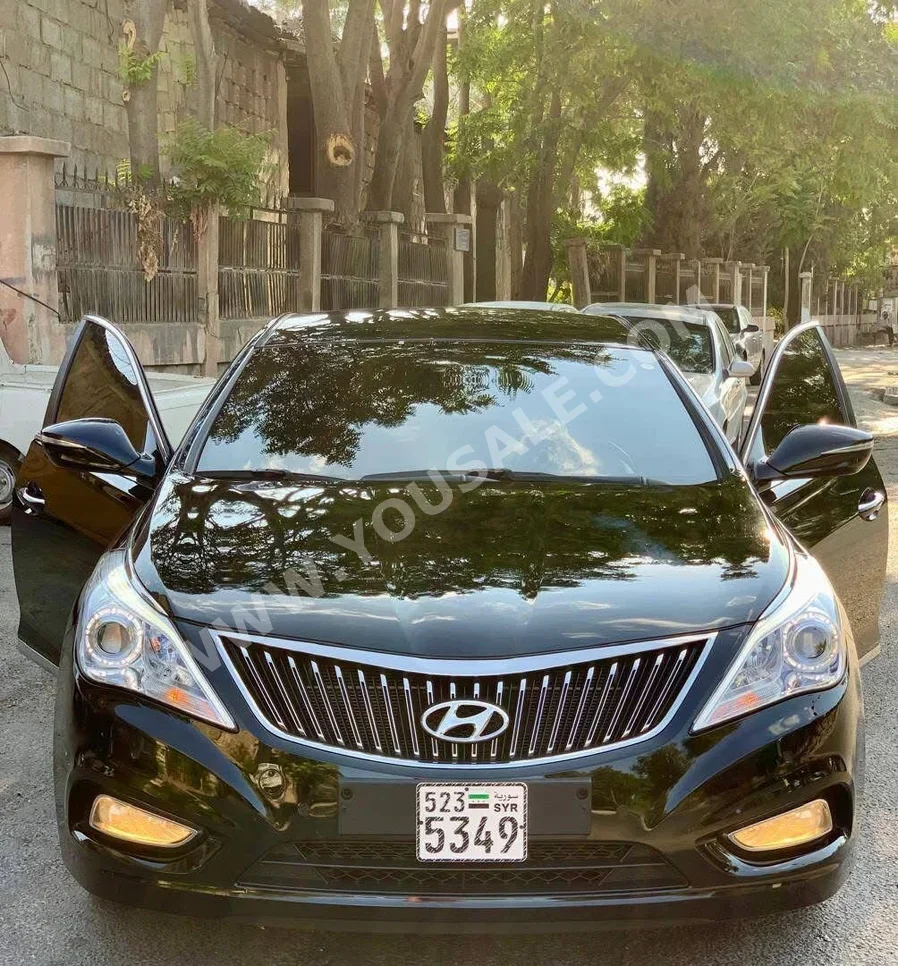 Hyundai  Grandeur  2013  Automatic  170,000 km  4 Cylinder  FWD  Sedan  Black  Gasoline