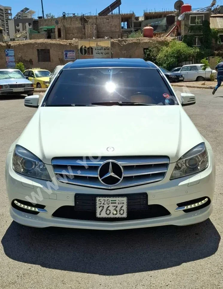 Mercedes-Benz  C-Class  200  2011  Automatic  99,000 km  4 Cylinder  RWD  Sedan  White  Gasoline
