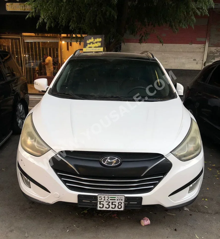 Hyundai  Tucson  2016  Automatic  115,000 km  4 Cylinder  4WD  SUV  White  Gasoline