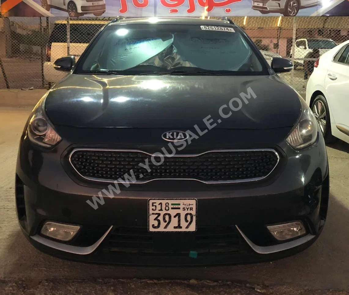 Kia  Niro  2019  Automatic  127,000 km  4 Cylinder  4WD  SUV  Gray  Hybrid
