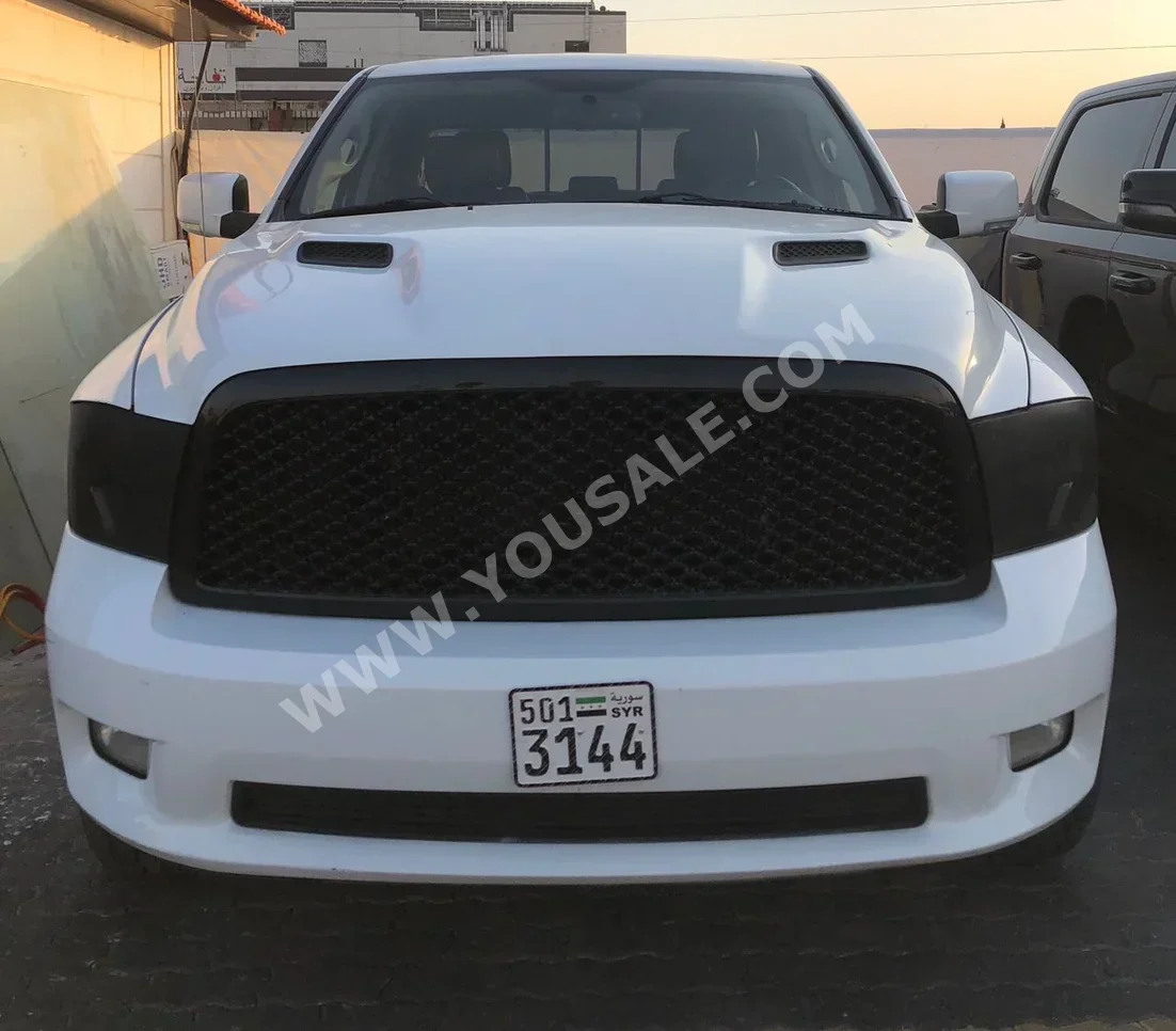 Dodge  Ram  1500  2011  Automatic  110,000 km  8 Cylinder  4WD  Pick Up  White  Gasoline