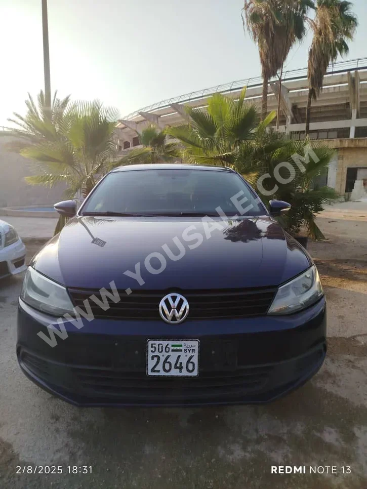 Volkswagen  Jetta  2012  Automatic  193,000 km  4 Cylinder  FWD  Sedan  Blue  Gasoline