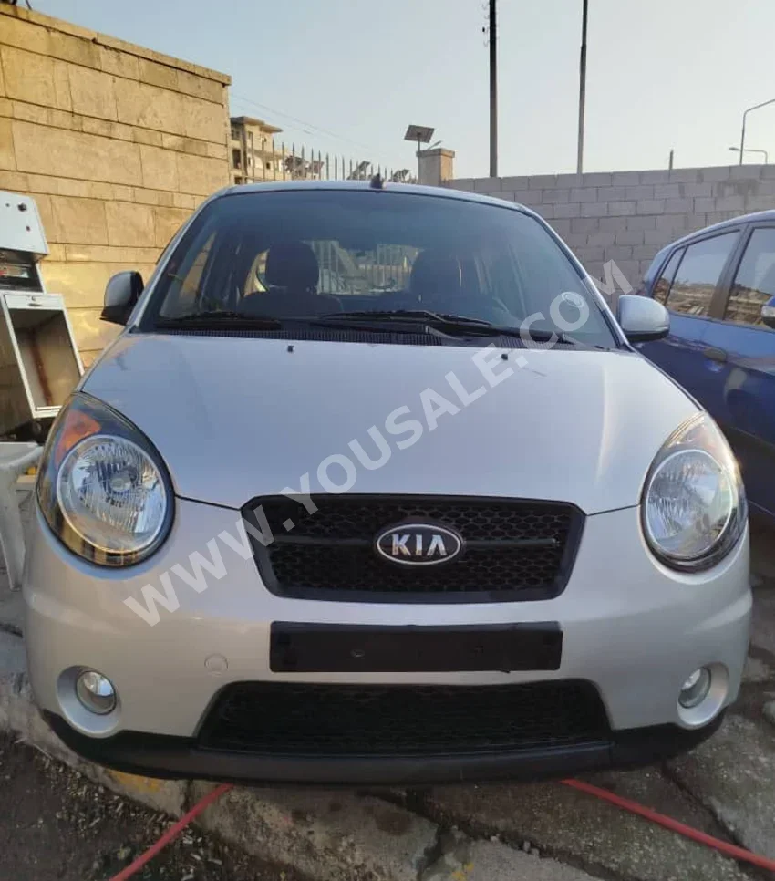 Kia  Picanto  2010  Automatic  140,000 km  3 Cylinder  FWD  Hatchback  Silver  Gasoline