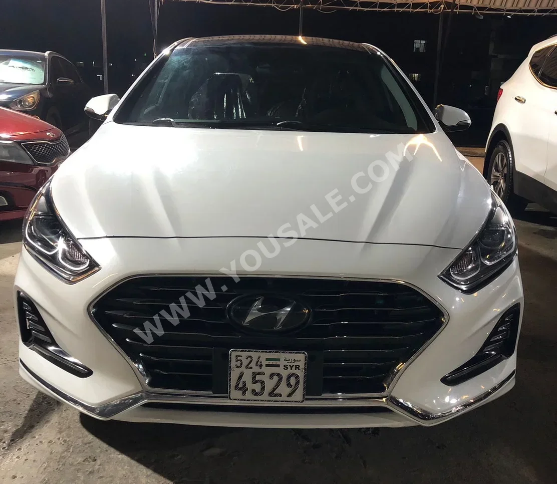 هيونداي سوناتا 2019 اتوماتيك 100,000 كم 4 سلندر دفع أمامي سيدان أبيض بنزين