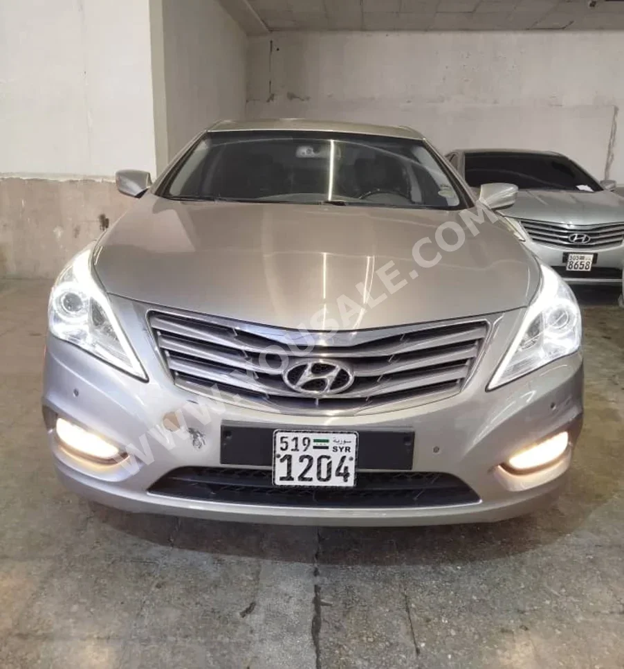 Hyundai  Grandeur  2012  Automatic  162,000 km  4 Cylinder  FWD  Sedan  Silver  Gasoline