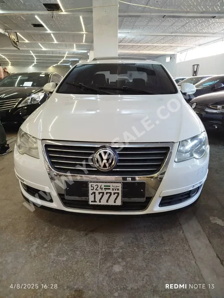 Volkswagen  Passat  2010  Automatic  180,000 km  4 Cylinder  FWD  Sedan  White  Diesel