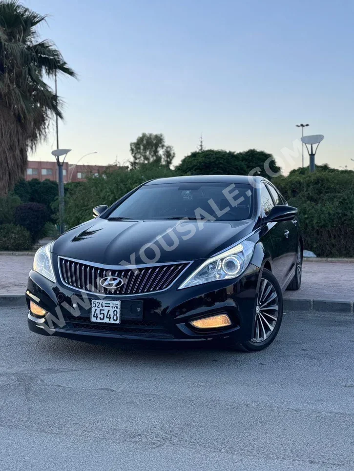 Hyundai  Azera  2014  Automatic  186,000 km  4 Cylinder  FWD  Sedan  Black  Gasoline