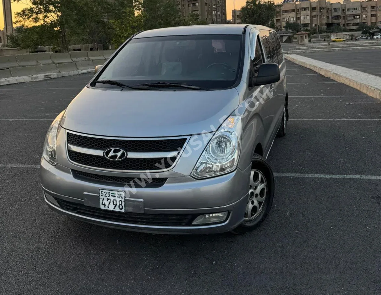 Hyundai  H1  2015  Automatic  300,000 km  4 Cylinder  FWD  Van / Bus  Silver  Gasoline
