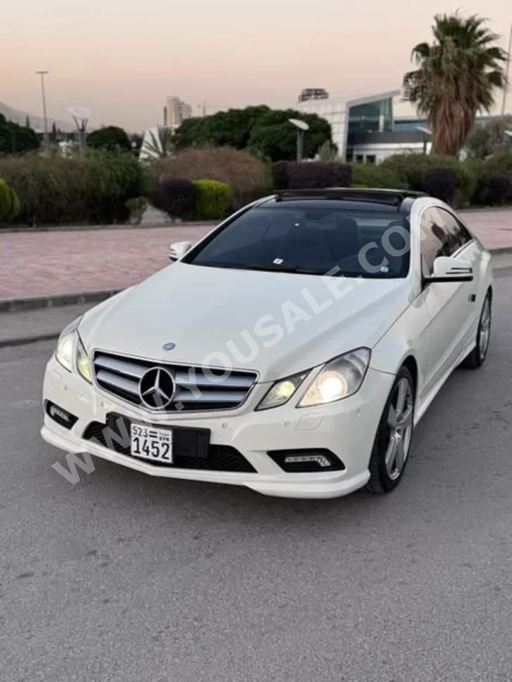 Mercedes-Benz  E-Class  350  2011  Automatic  104,000 km  4 Cylinder  RWD  Sedan  White  Gasoline