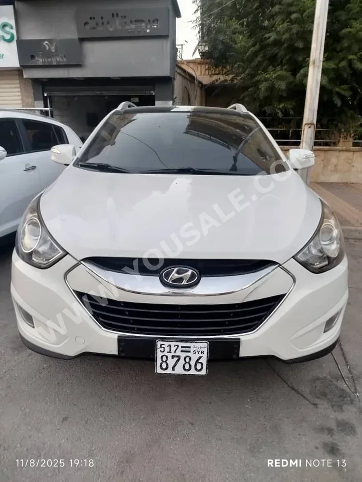 Hyundai  Tucson  2011  Automatic  190,000 km  4 Cylinder  RWD  SUV  White  Diesel