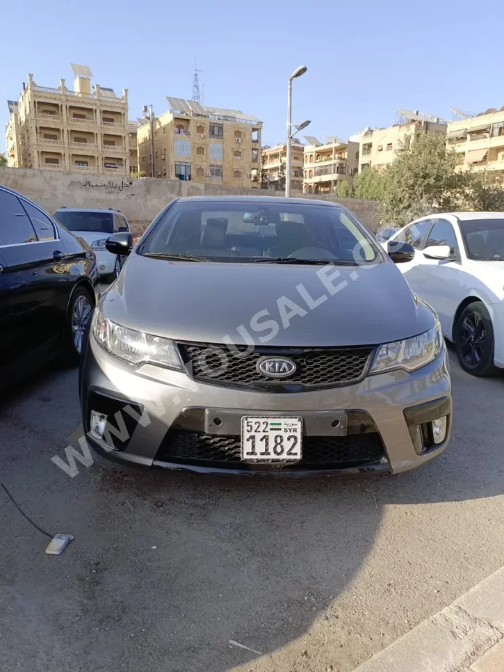 Kia  Forte  2012  Automatic  116,000 km  4 Cylinder  FWD  Coupe / Sport  Dark Gray  Gasoline