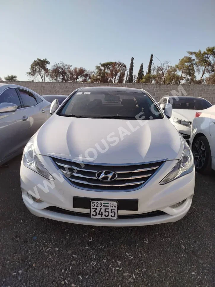 Hyundai  Sonata  2012  Automatic  184,000 km  4 Cylinder  FWD  Sedan  White  Gasoline
