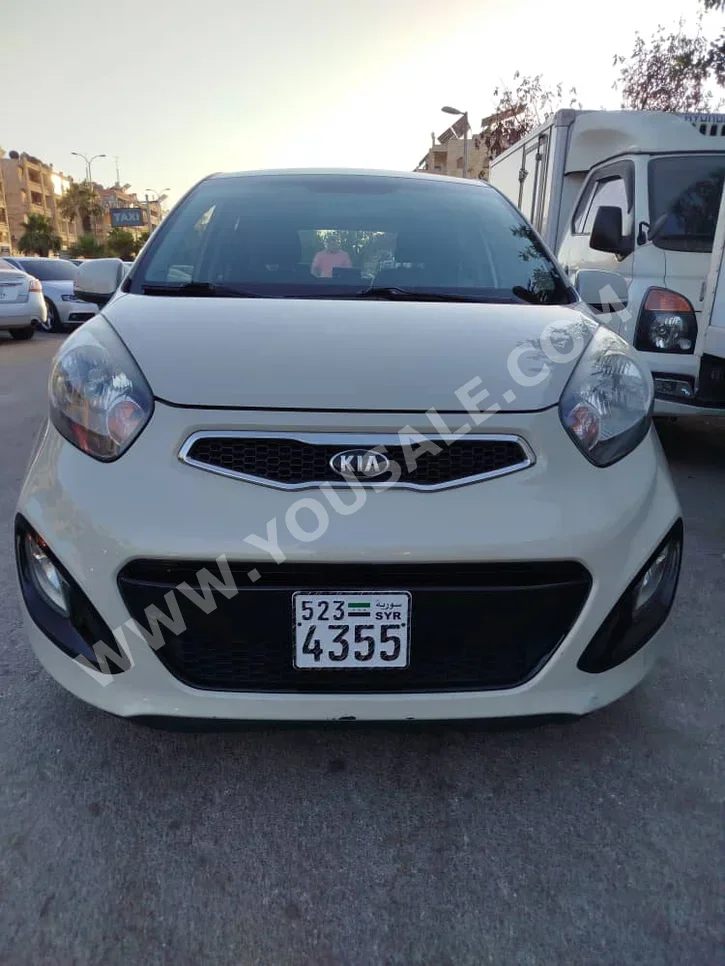 Kia  Picanto  2013  Automatic  185,000 km  4 Cylinder  FWD  Hatchback  Light Beige  Gasoline