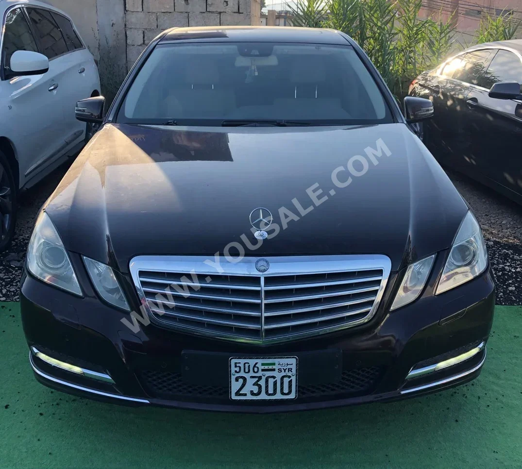 Mercedes-Benz  E-Class  300  2011  Automatic  156,000 km  4 Cylinder  RWD  Sedan  Brown  Gasoline
