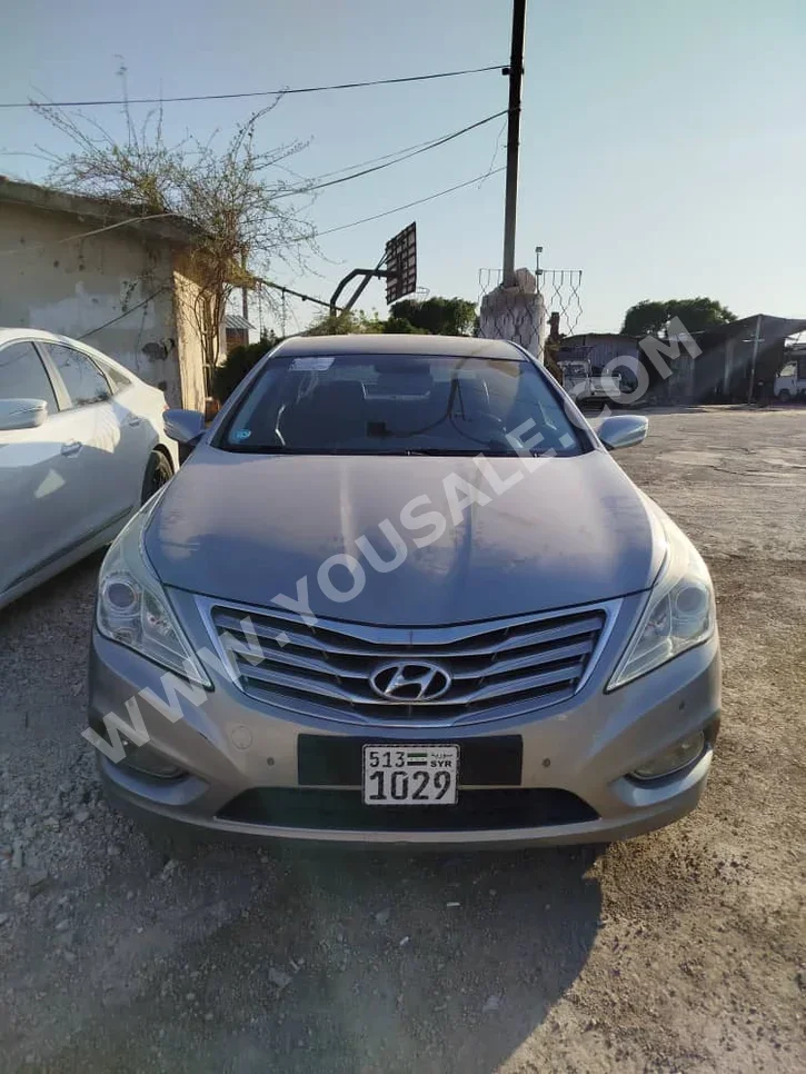 Hyundai  Grandeur  2012  Automatic  141,000 km  4 Cylinder  FWD  Sedan  Silver  Gasoline