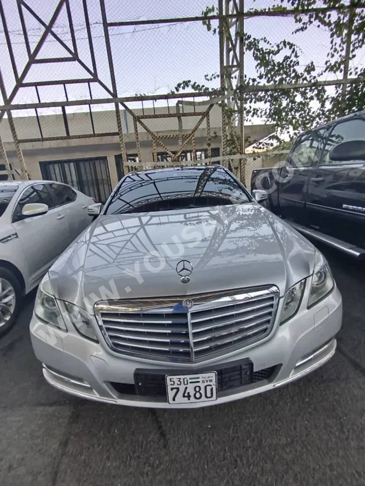Mercedes-Benz  E-Class  300  2012  Automatic  180,000 km  6 Cylinder  RWD  Sedan  Silver  Gasoline