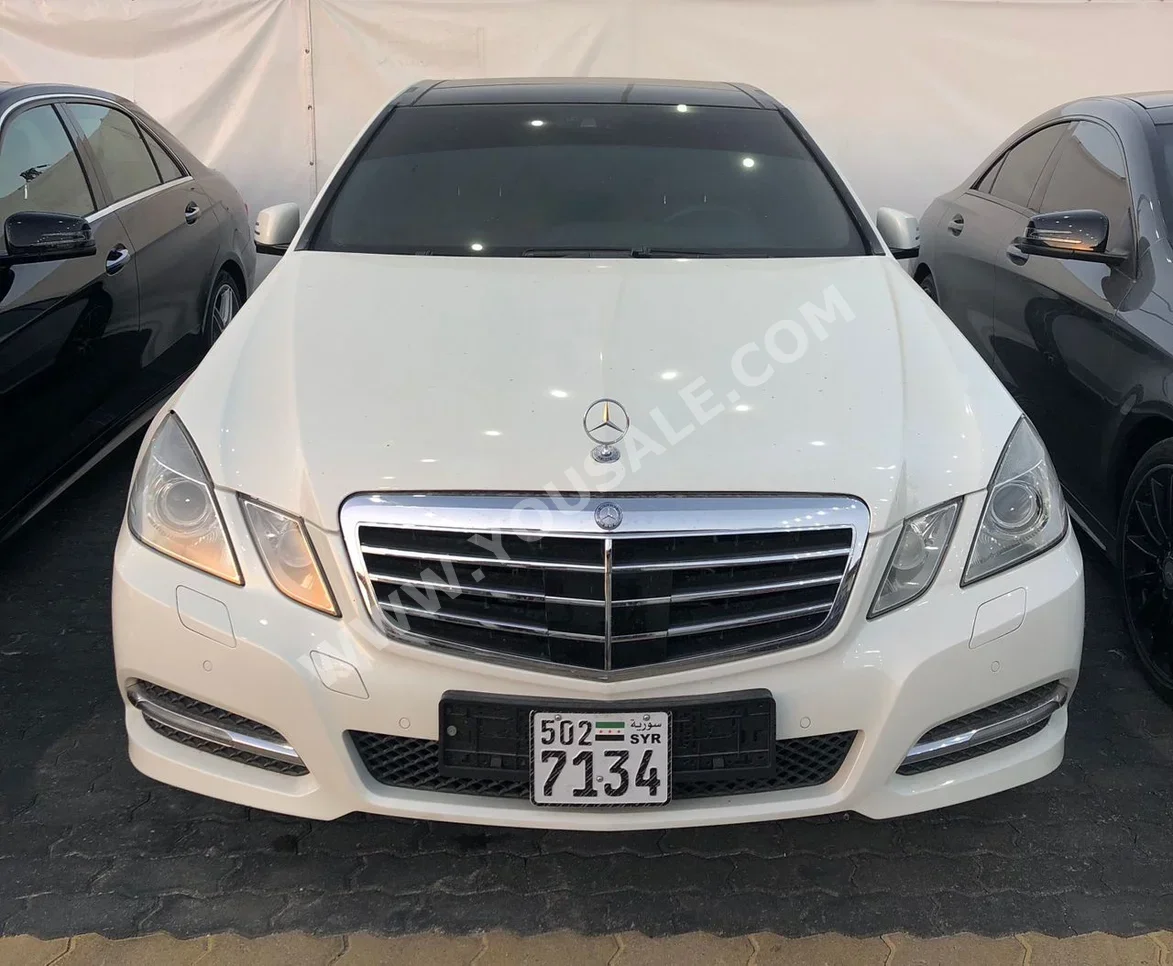 Mercedes-Benz  E-Class  300  2012  Automatic  208,000 km  4 Cylinder  RWD  Sedan  White  Gasoline