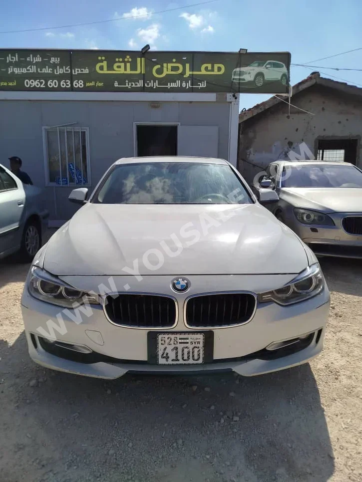 BMW  3-Series  320i  2011  Automatic  158,000 km  4 Cylinder  RWD  Sedan  White  Gasoline