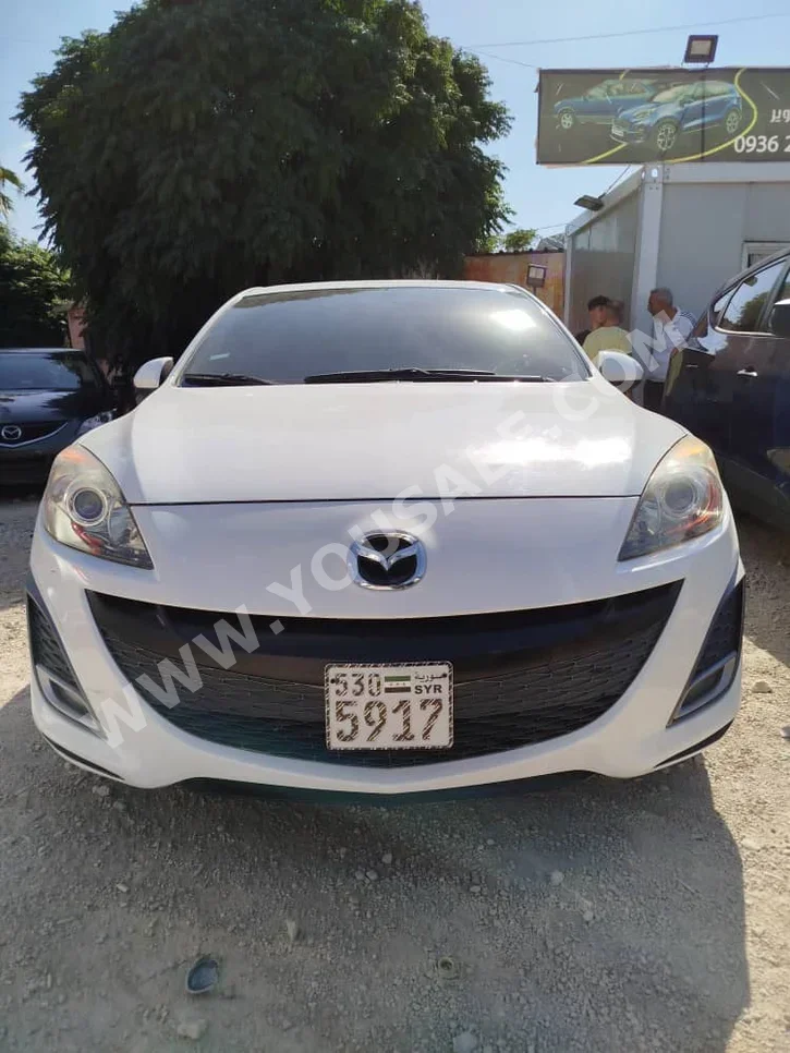 Mazda  Mazda 3  2012  Automatic  116,903 km  4 Cylinder  FWD  Hatchback  White  Gasoline