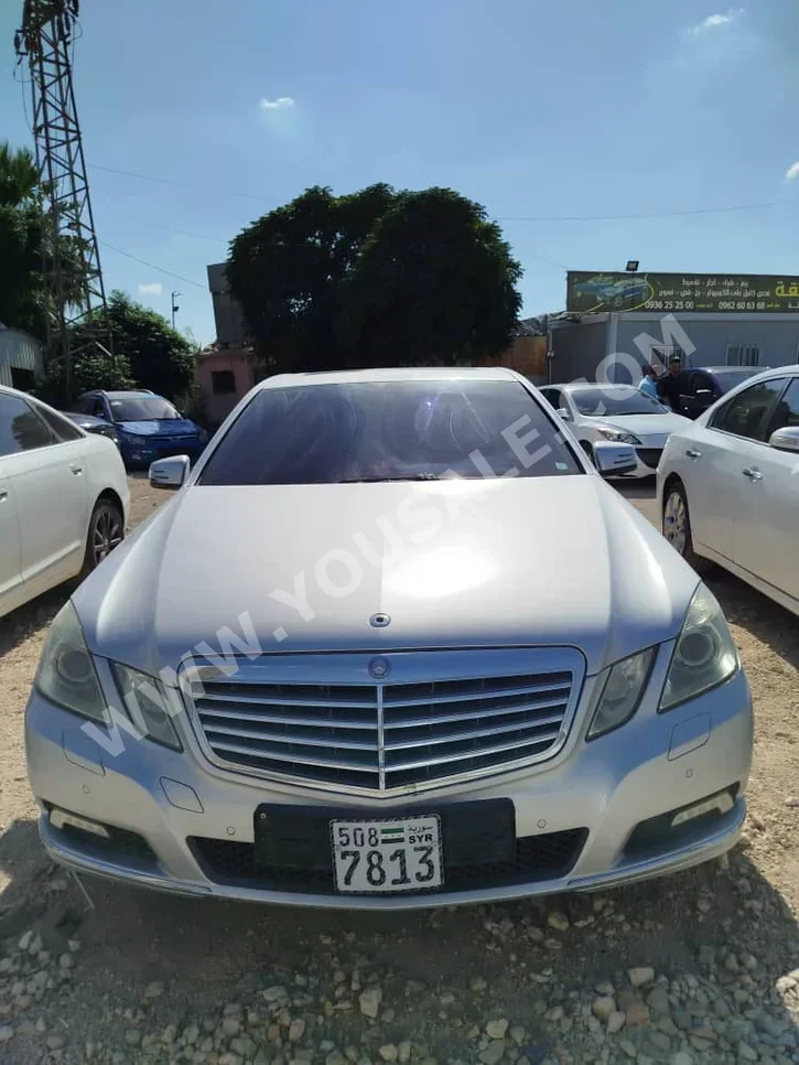Mercedes-Benz  E-Class  350  2011  Automatic  303,327 km  6 Cylinder  RWD  Sedan  Silver  Gasoline
