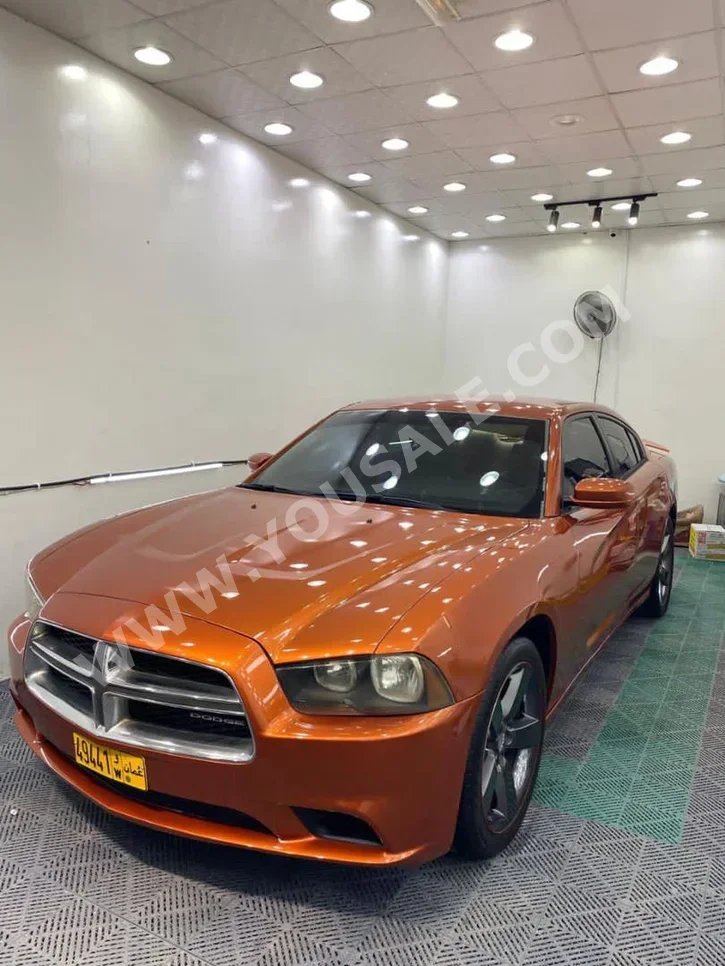 Dodge  Charger  2011  Automatic  180,000 km  6 Cylinder  RWD  Sedan  Orange  Gasoline