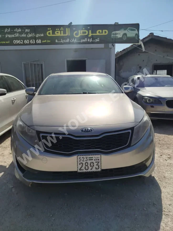 Kia  Optima  2013  Automatic  124,000 km  4 Cylinder  FWD  Sedan  Silver  Hybrid