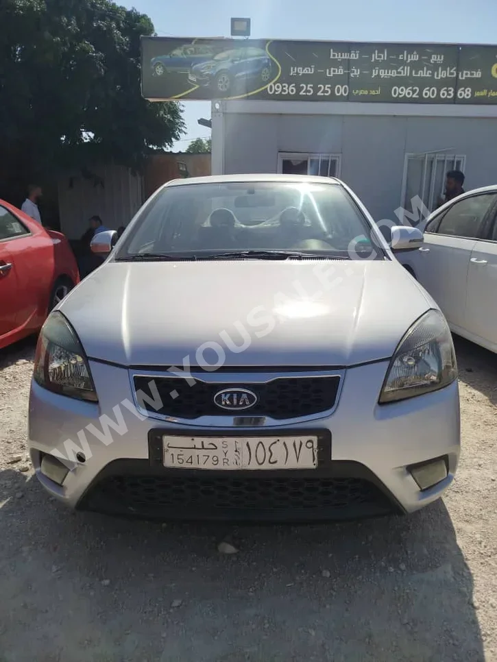 Kia  Rio  2009  Automatic  210,000 km  4 Cylinder  FWD  Sedan  Silver  Gasoline