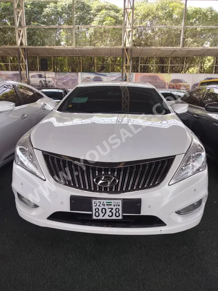 Hyundai  Grandeur  2011  Automatic  239,000 km  6 Cylinder  FWD  Sedan  White  Gasoline