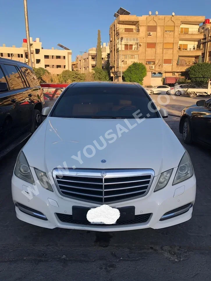 Mercedes-Benz  E-Class  300  2012  Automatic  190,000 km  6 Cylinder  RWD  Sedan  White  Gasoline