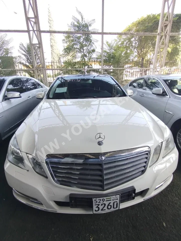 Mercedes-Benz  E-Class  300  2012  Automatic  137,000 km  6 Cylinder  RWD  Sedan  White  Gasoline