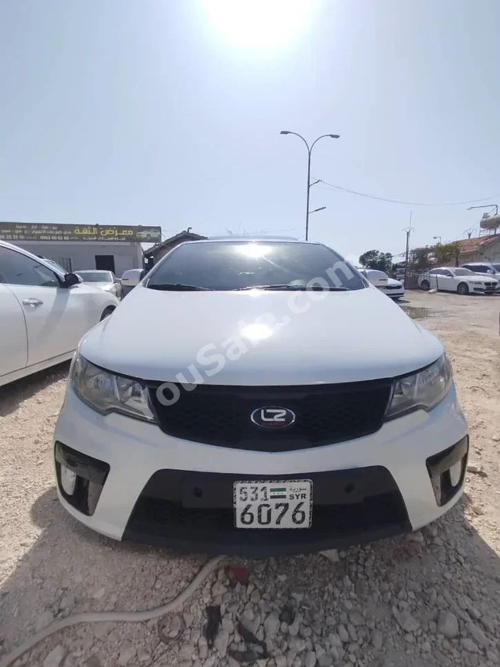 Kia  Forte  2011  Automatic  110,000 km  4 Cylinder  FWD  Coupe / Sport  White  Gasoline