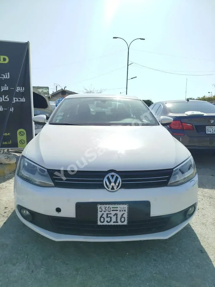 Volkswagen  Jetta  2012  Automatic  123,000 km  4 Cylinder  FWD  Sedan  White  Diesel
