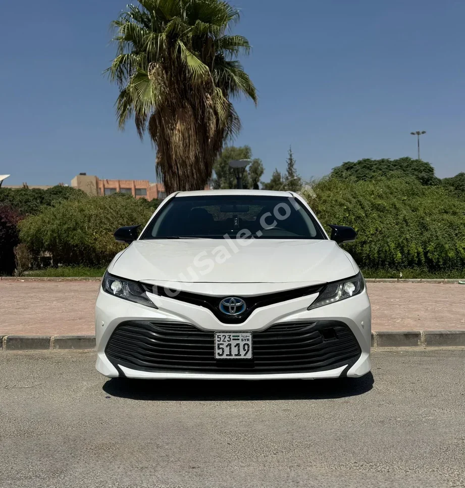 Toyota  Camry  LE  2020  Automatic  93,000 km  4 Cylinder  RWD  Sedan  White  Hybrid