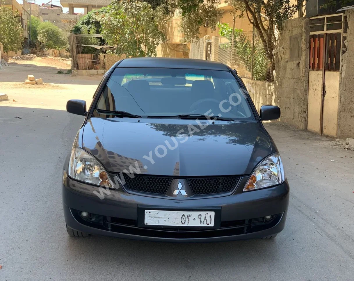 Mitsubishi  Lancer  2008  Automatic  221,000 km  4 Cylinder  FWD  Sedan  Gray  Gasoline