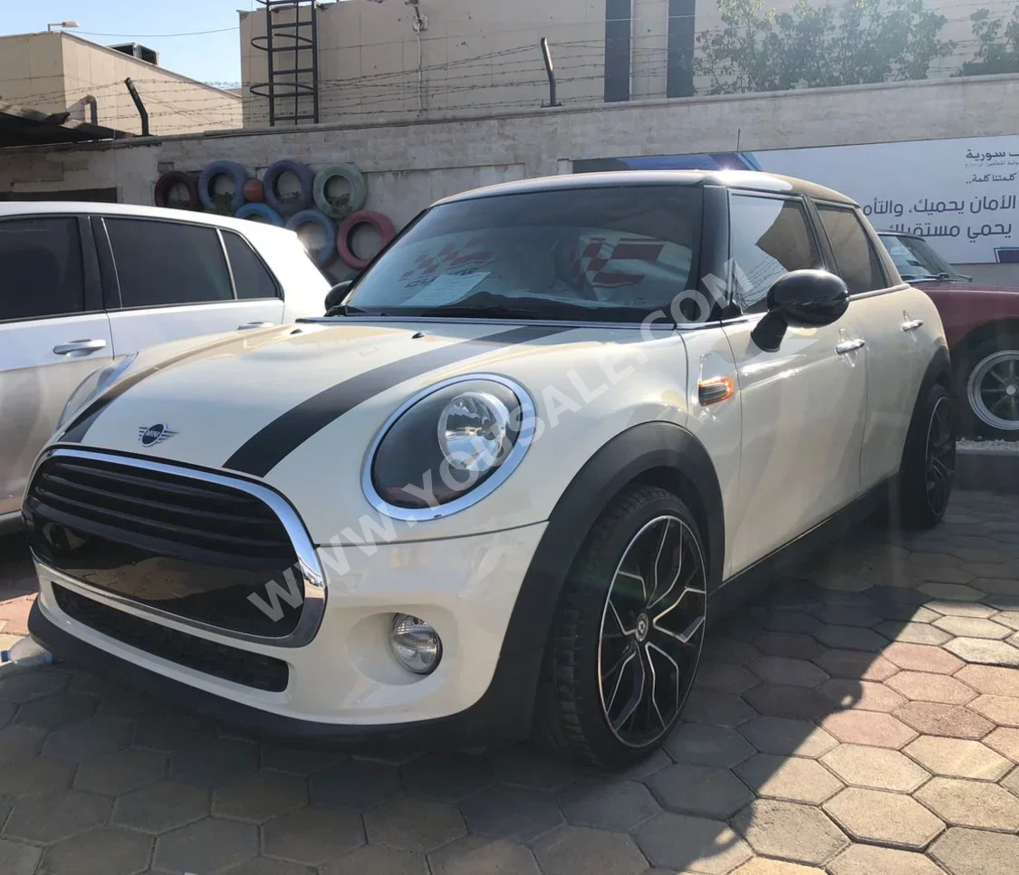 Mini  Cooper  2019  Automatic  77,000 km  4 Cylinder  FWD  Hatchback  White & Black  Gasoline