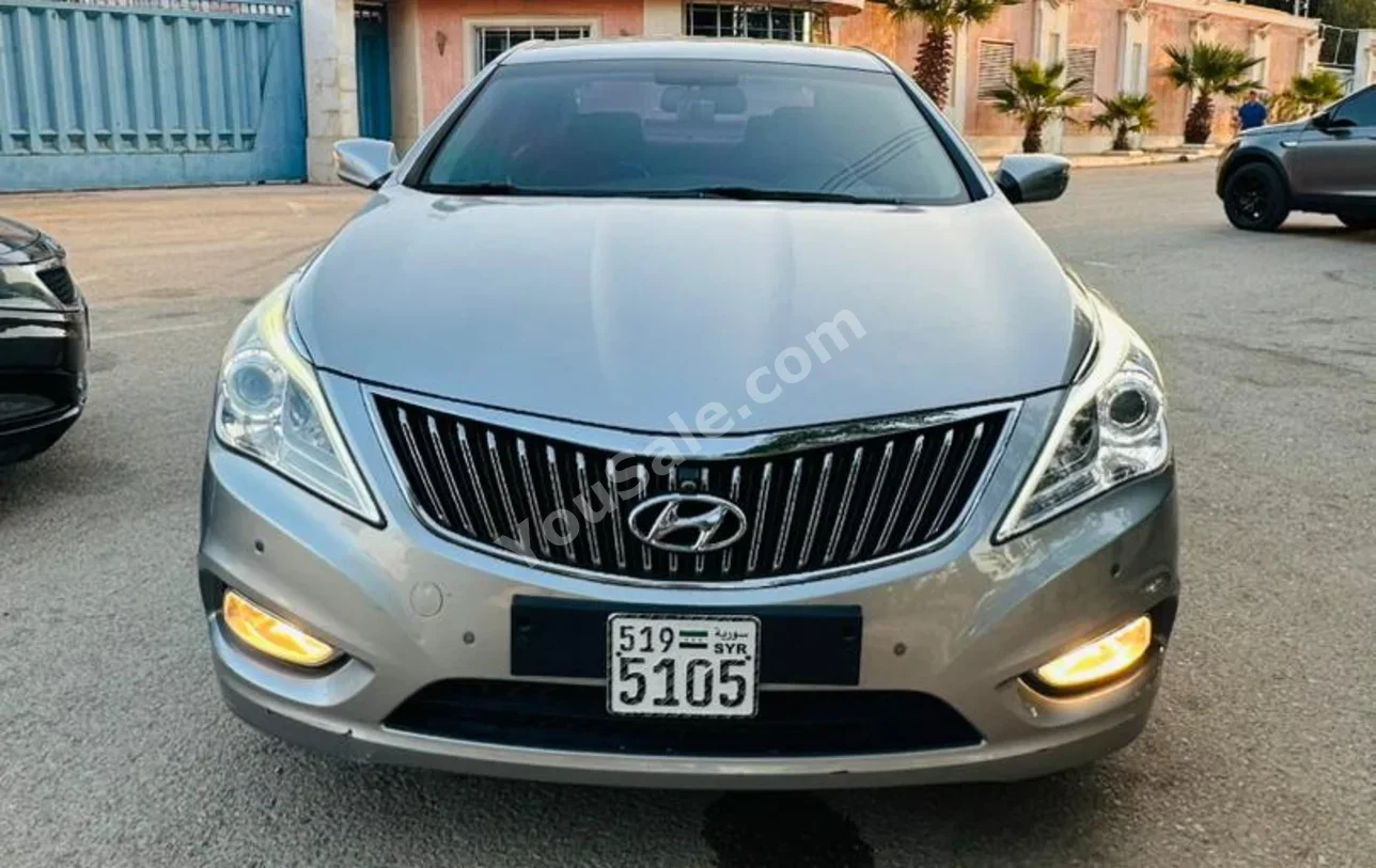 Hyundai  Azera  2012  Automatic  162,000 km  4 Cylinder  FWD  Sedan  Gray  Gasoline