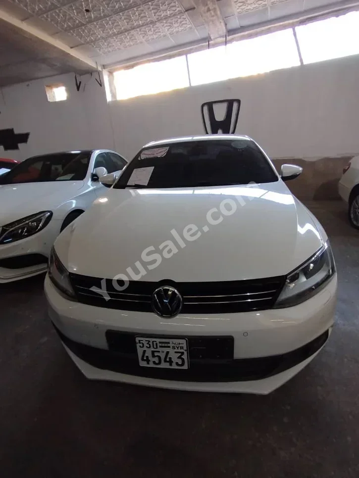 Volkswagen  Jetta  2011  Automatic  140,000 km  4 Cylinder  FWD  Sedan  White  Diesel