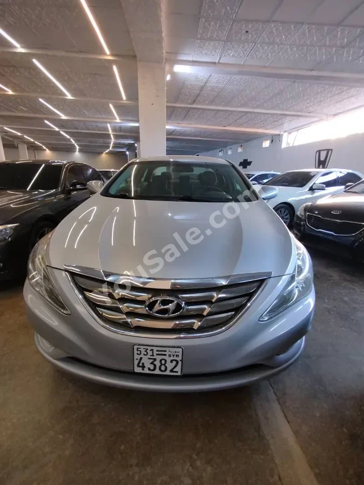 Hyundai  Sonata  2014  Automatic  170,000 km  4 Cylinder  FWD  Sedan  Silver  Gasoline