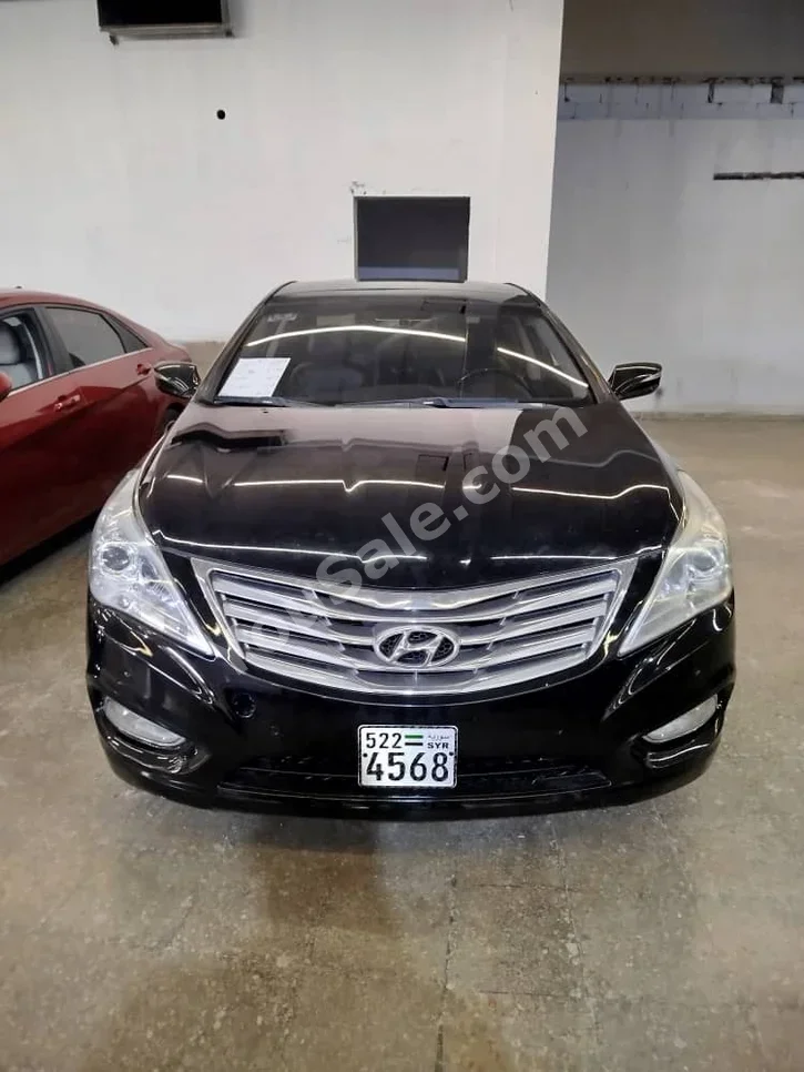 هيونداي  غراندير  2012  اتوماتيك  190,000 كم  6 سلندر  دفع أمامي  سيدان  أسود  بنزين