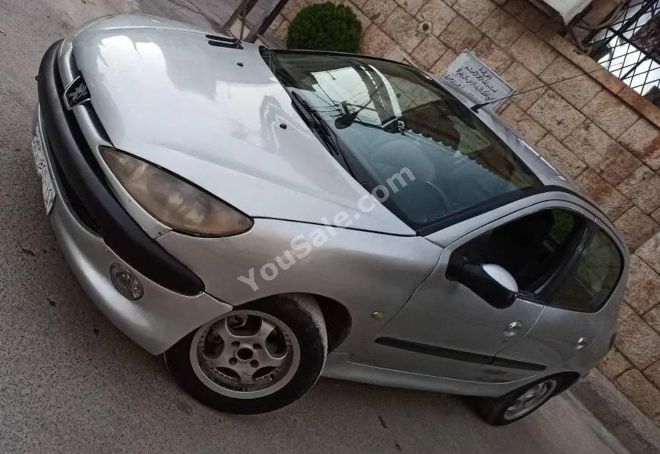 Peugeot  206  2002  Manual  232,000 km  4 Cylinder  FWD  Hatchback  Silver  Gasoline