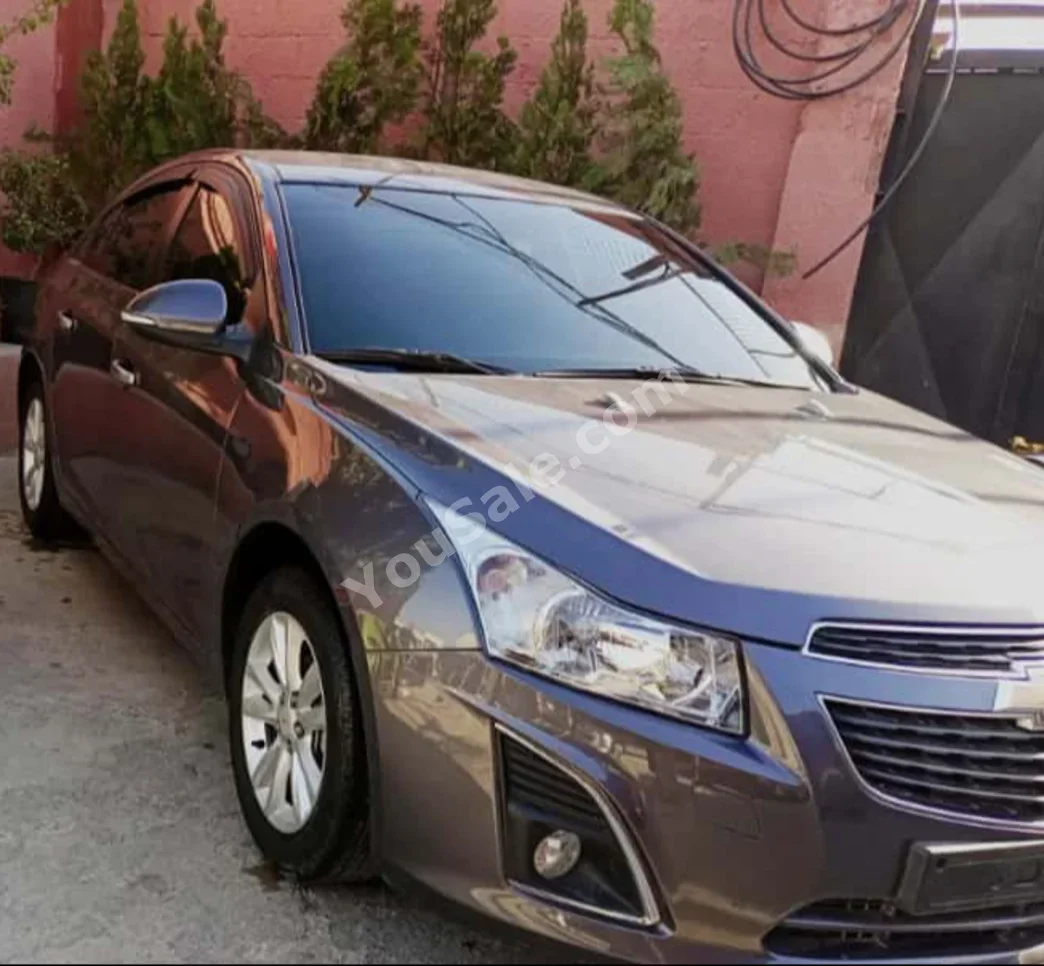 Chevrolet  Cruze  2015  Automatic  74,000 km  4 Cylinder  FWD  Sedan  Dark Gray  Gasoline