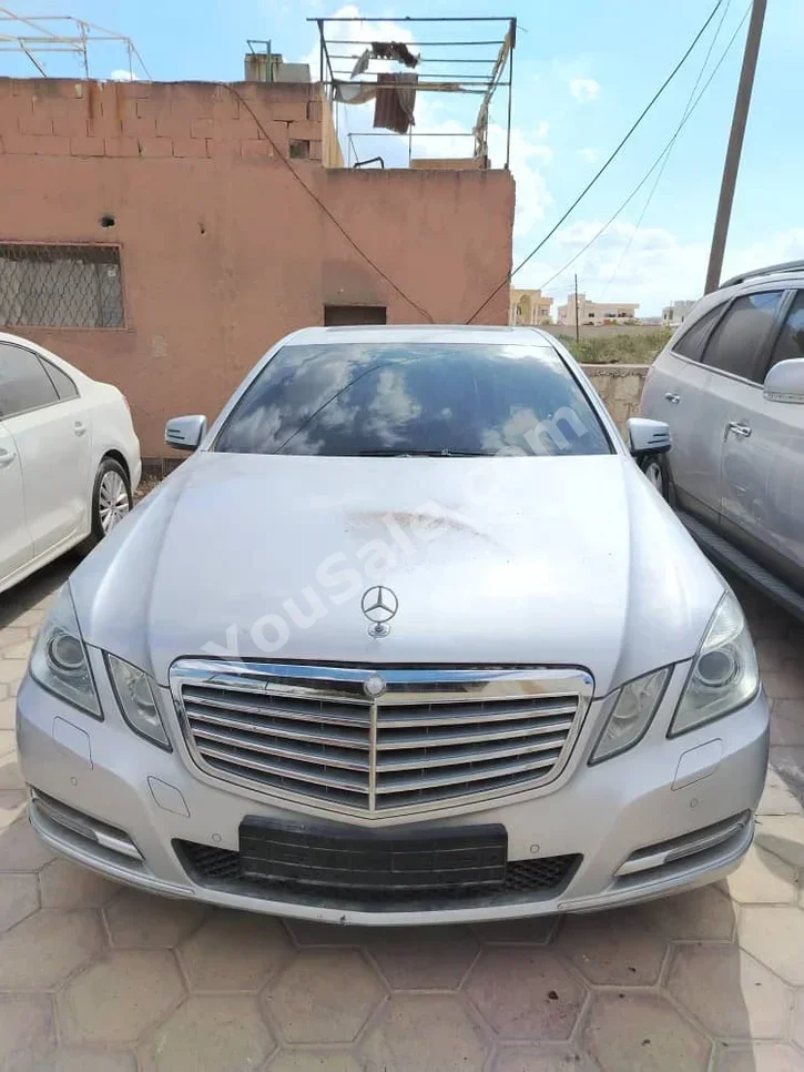 Mercedes-Benz  E-Class  300  2011  Automatic  80,000 km  4 Cylinder  RWD  Sedan  Silver  Gasoline