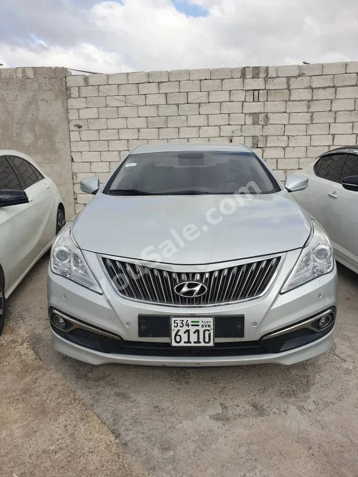Hyundai  Grandeur  2015  Automatic  130,000 km  4 Cylinder  FWD  Sedan  Silver  Gasoline