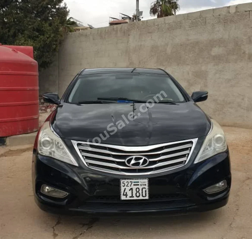 Hyundai  Grandeur  2012  Automatic  145,000 km  4 Cylinder  FWD  Sedan  Black  Gasoline