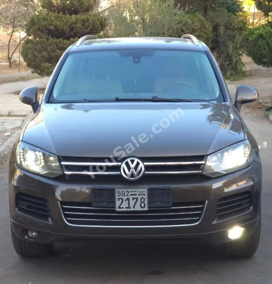 Volkswagen  Touareg  2012  Automatic  110,000 km  6 Cylinder  AWD  SUV  Brown  Gasoline
