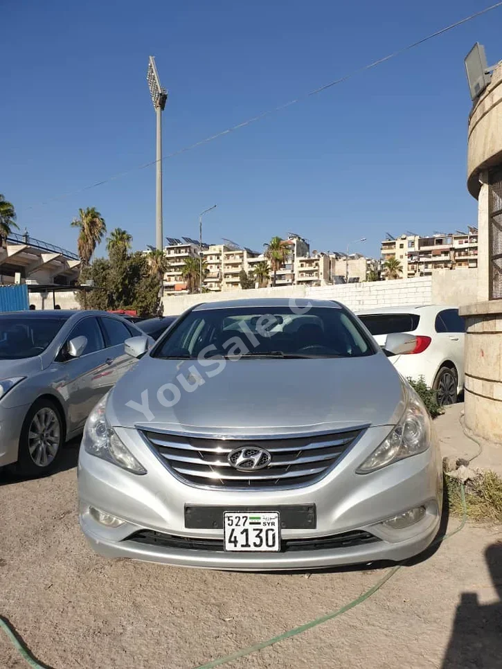 Hyundai  Sonata  2013  Automatic  161,000 km  4 Cylinder  FWD  Sedan  Silver  Gasoline